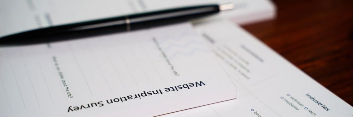 a pen sitting on top of a piece of paper